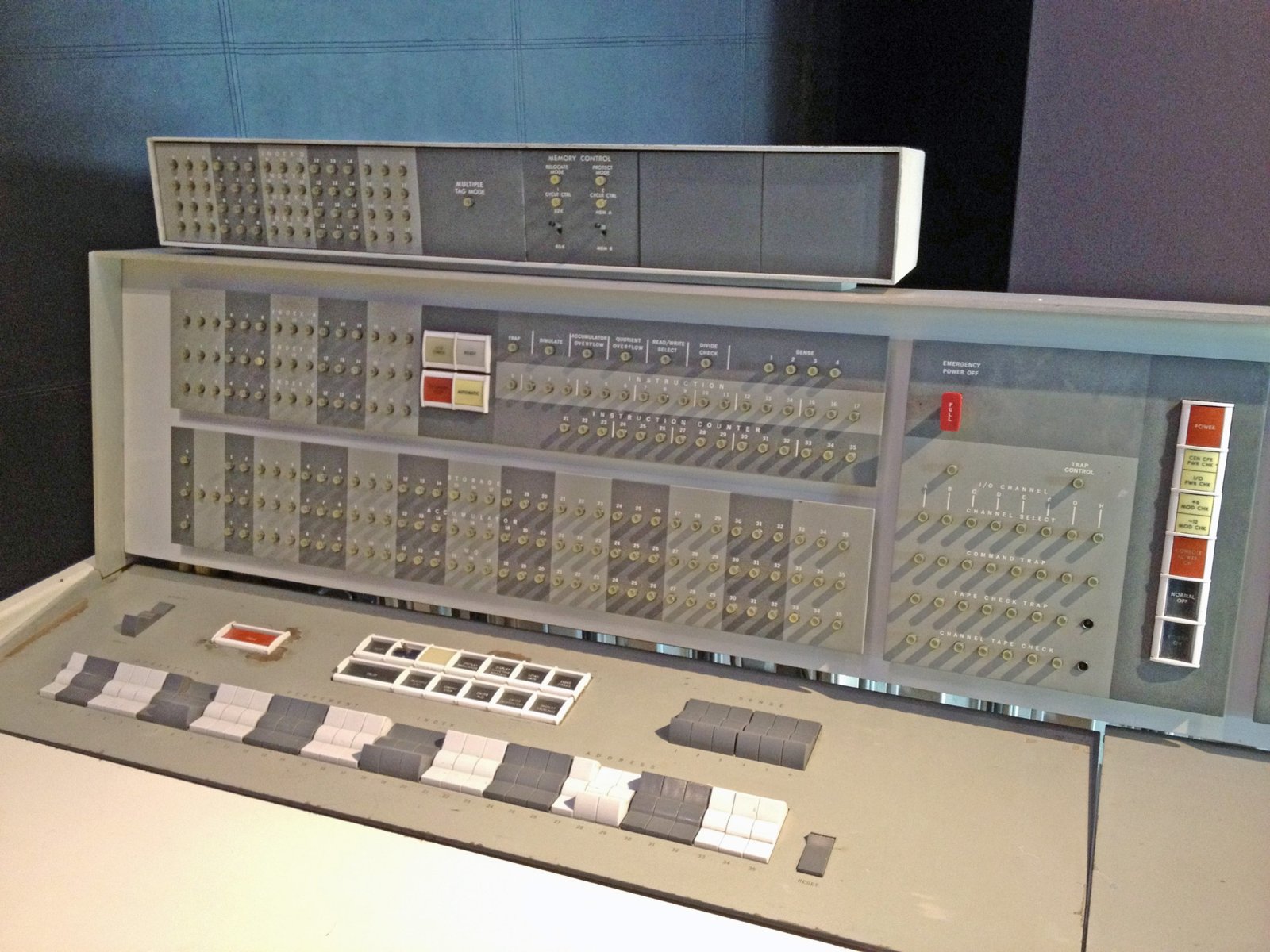 he operator console of an IBM 7094 mainframe computer, with rows of indicator lights and switches